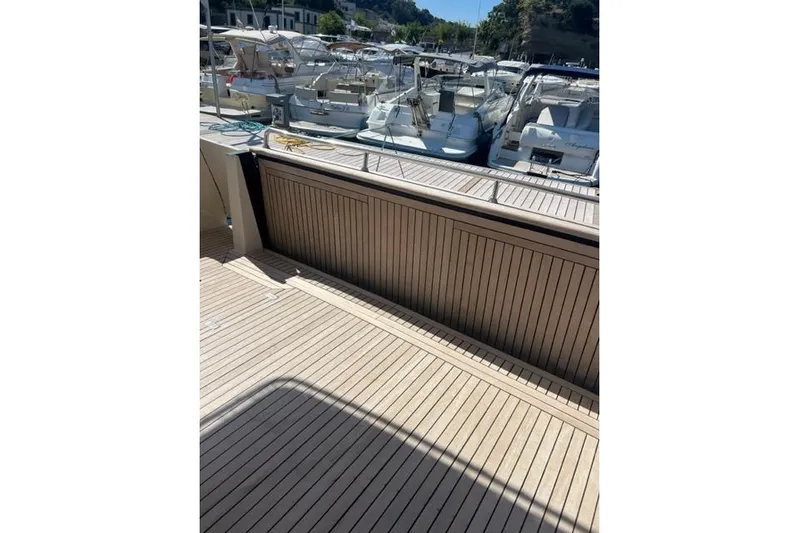  Yacht Photos Pics Apreamare Maestro 65 yacht deck, 2008 model, docked with other boats in marina.