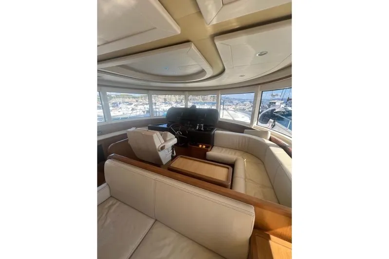  Yacht Photos Pics Luxurious interior of 2008 Apreamare Maestro 65 yacht with panoramic windows and plush seating.
