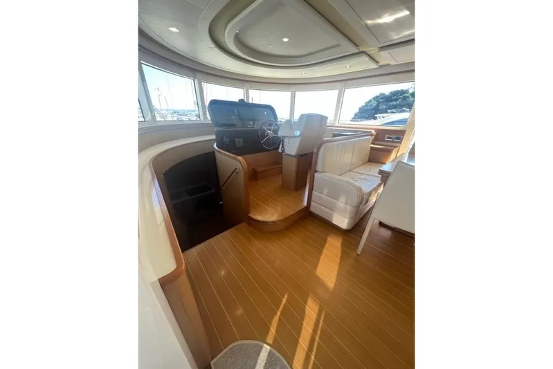  Yacht Photos Pics Interior of 2008 Apreamare Maestro 65 yacht with wooden flooring and helm station.