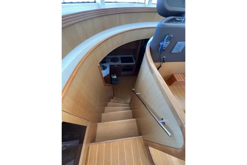  Yacht Photos Pics Staircase inside 2008 Apreamare Maestro 65 yacht, featuring elegant wood finish and modern design.