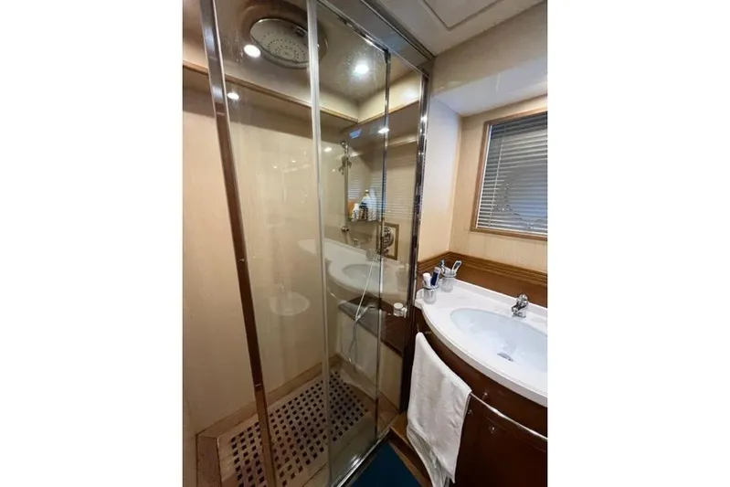  Yacht Photos Pics Luxurious bathroom in 2008 Apreamare Maestro 65 yacht with glass shower and modern sink.