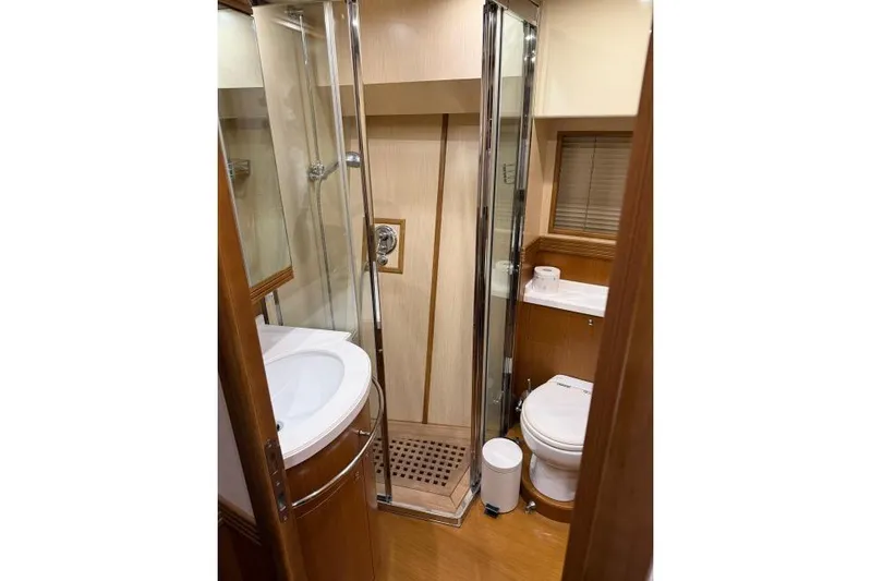  Yacht Photos Pics Luxurious bathroom in 2008 Apreamare Maestro 65 yacht with shower, sink, and toilet.