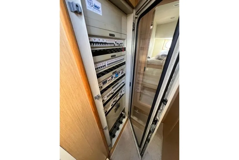  Yacht Photos Pics Electrical panel inside 2008 Apreamare Maestro 65 yacht, showcasing circuit breakers and controls.