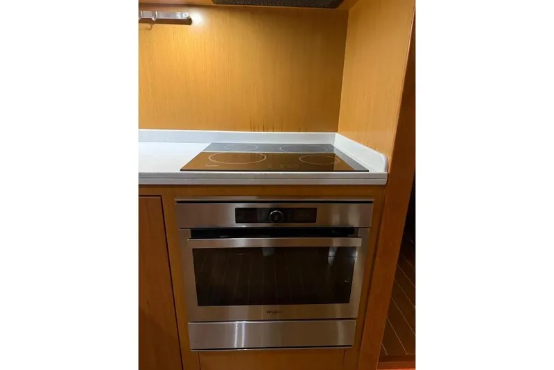  Yacht Photos Pics Modern kitchen with stainless steel oven and cooktop on 2008 Apreamare Maestro 65 yacht.