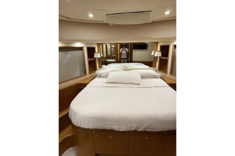  Yacht Photos Pics Luxurious bedroom interior of 2008 Apreamare Maestro 65 yacht with elegant furnishings.
