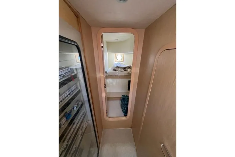  Yacht Photos Pics Interior view of 2008 Apreamare Maestro 65 yacht cabin with bed and porthole.