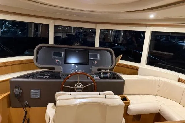  Yacht Photos Pics Interior helm of 2008 Apreamare Maestro 65 yacht with leather seating and navigation controls.