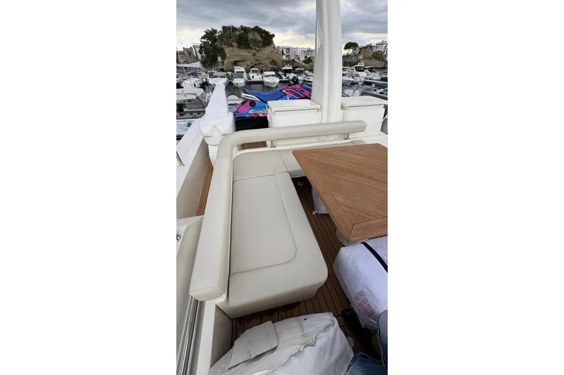  Yacht Photos Pics Luxurious seating area on 2008 Apreamare Maestro 65 yacht, docked in a marina.