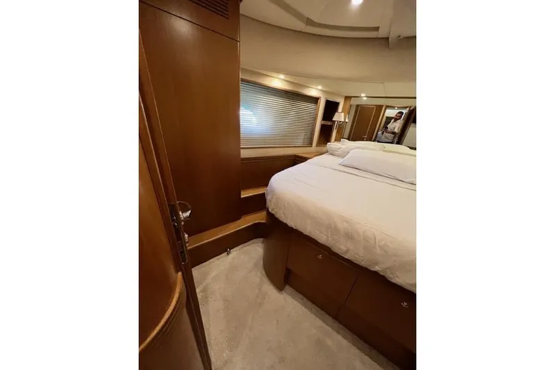  Yacht Photos Pics Luxurious bedroom interior of 2008 Apreamare Maestro 65 yacht with wooden finishes.
