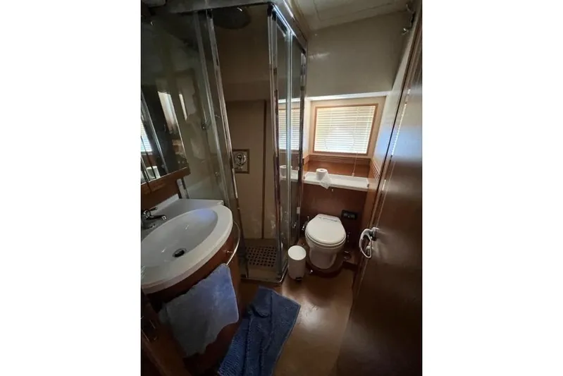  Yacht Photos Pics Luxurious bathroom in 2008 Apreamare Maestro 65 yacht with shower, sink, and toilet.