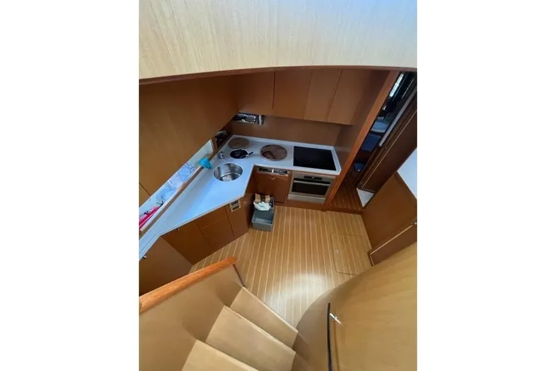  Yacht Photos Pics 2008 Apreamare Maestro 65 yacht kitchen with modern appliances and wooden cabinetry.