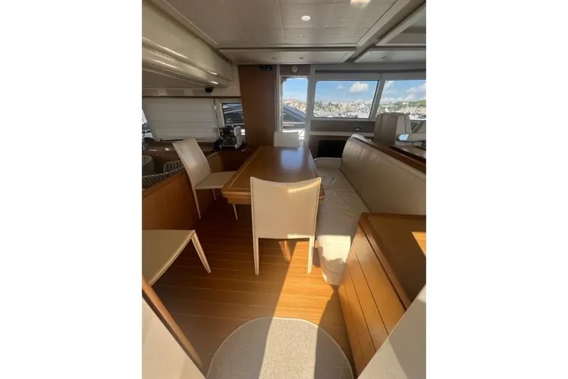  Yacht Photos Pics Luxurious interior of 2008 Apreamare Maestro 65 yacht with elegant seating and wooden finishes.