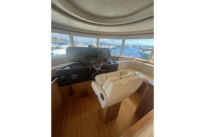 Yacht Photos Pics Interior of 2008 Apreamare Maestro 65 yacht with helm and panoramic windows.