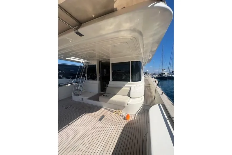  Yacht Photos Pics 2008 Apreamare Maestro 65 yacht deck with seating, docked at marina.