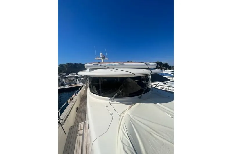  Yacht Photos Pics 2008 Apreamare Maestro 65 yacht docked under clear blue sky.