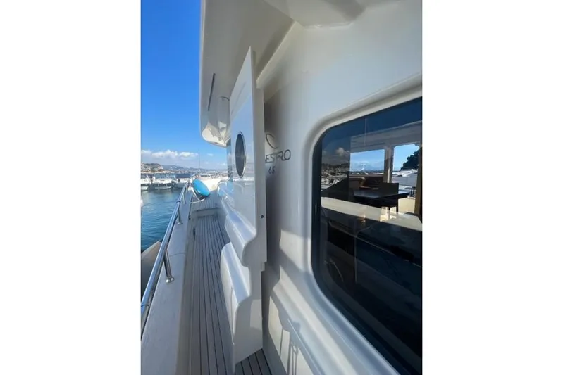  Yacht Photos Pics 2008 Apreamare Maestro 65 yacht deck with marina view and clear blue sky.