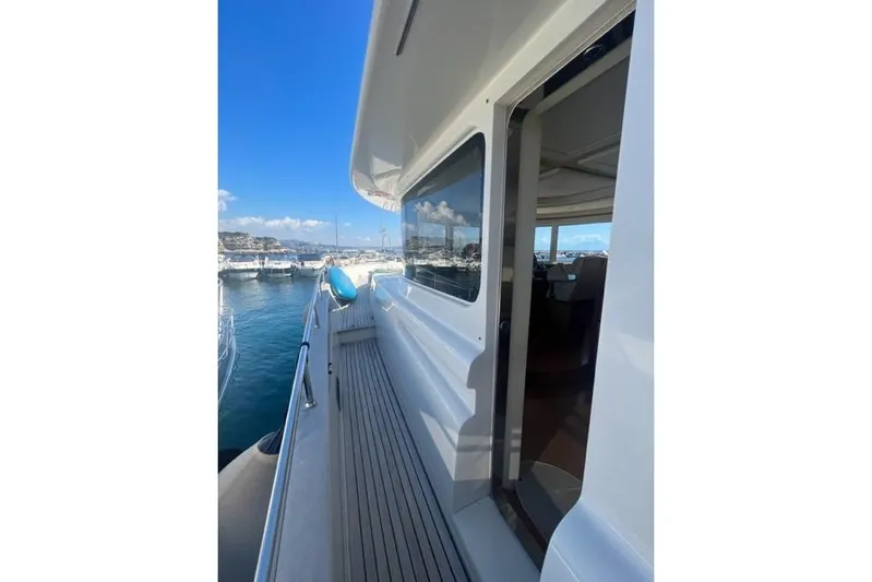  Yacht Photos Pics 2008 Apreamare Maestro 65 yacht docked, showcasing sleek exterior and spacious deck.