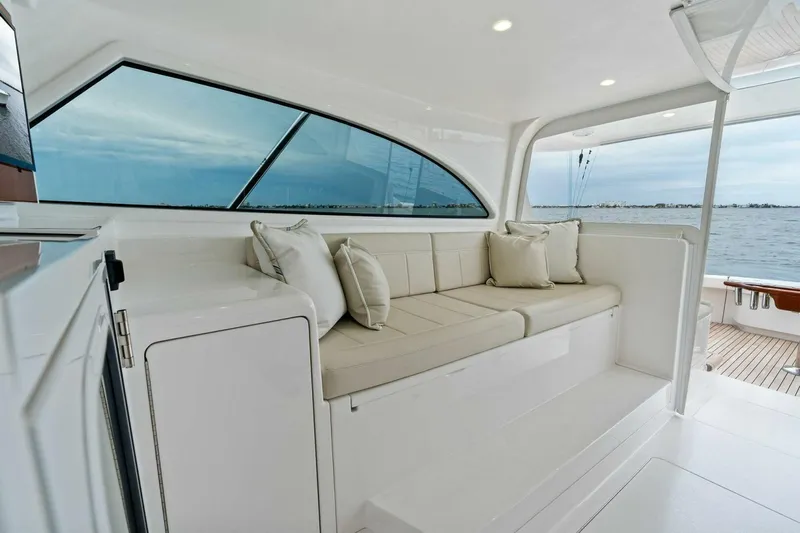 Damfino Yacht Photos Pics Luxurious interior of 2021 Viking 46 Billfish yacht with comfortable seating and ocean view.