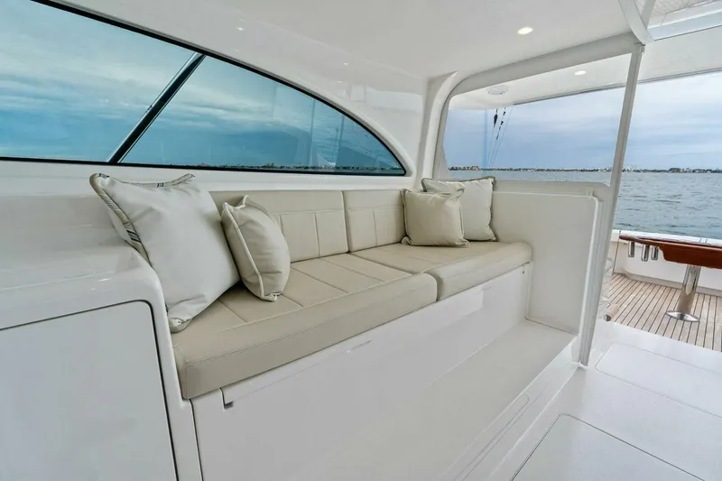 Damfino Yacht Photos Pics Luxurious seating area on 2021 Viking 46 Billfish yacht with ocean view.