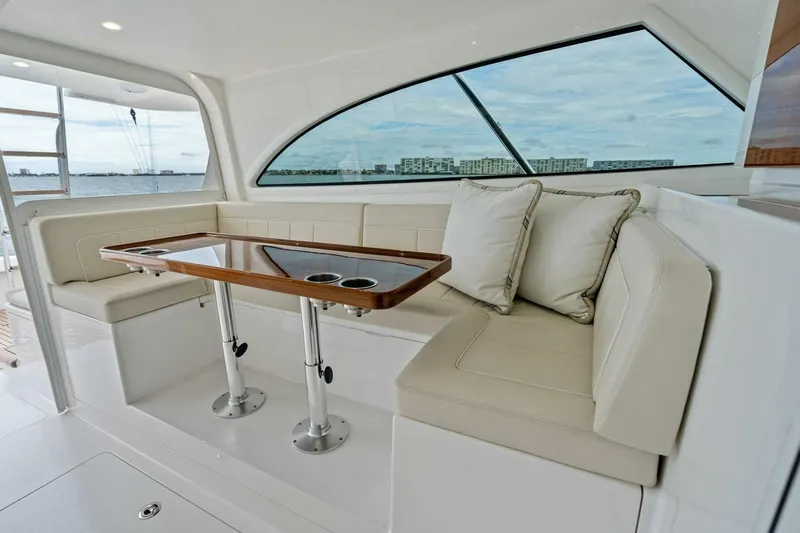 Damfino Yacht Photos Pics Luxurious seating area on 2021 Viking 46 Billfish yacht with ocean view.