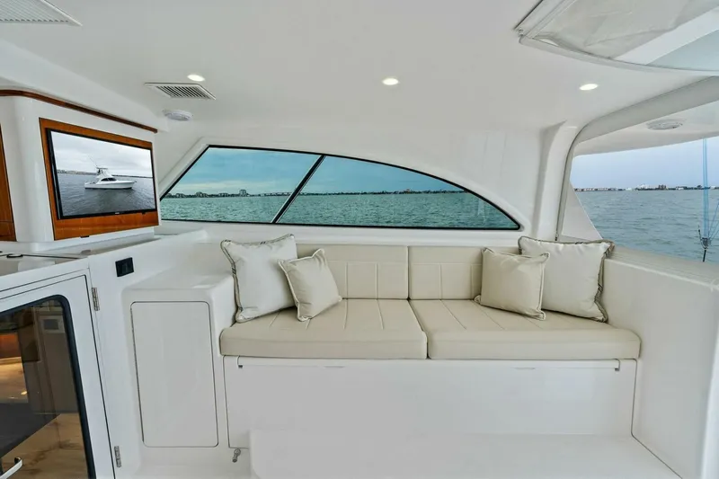 Damfino Yacht Photos Pics Interior of 2021 Viking 46 Billfish yacht with seating and ocean view.