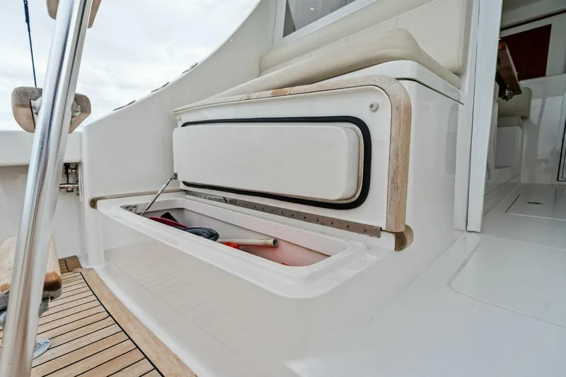 Damfino Yacht Photos Pics Storage compartment on 2021 Viking 46 Billfish yacht, featuring sleek design and wooden accents.