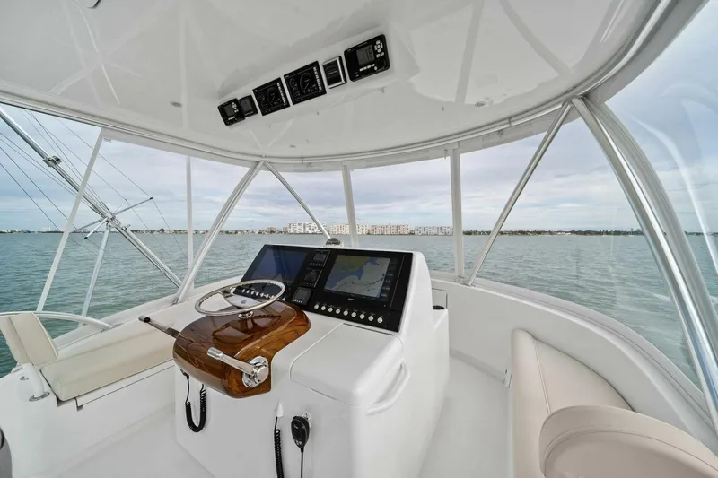 Damfino Yacht Photos Pics Helm of 2021 Viking 46 Billfish yacht with navigation controls and ocean view.