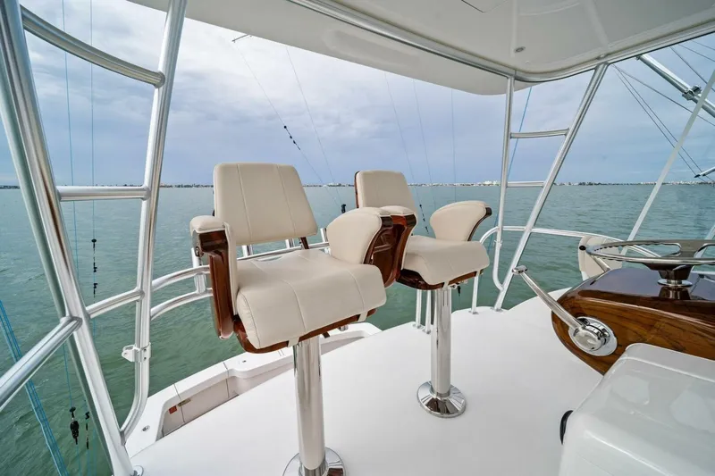 Damfino Yacht Photos Pics 2021 Viking 46 Billfish yacht helm with two white captain chairs overlooking the ocean.