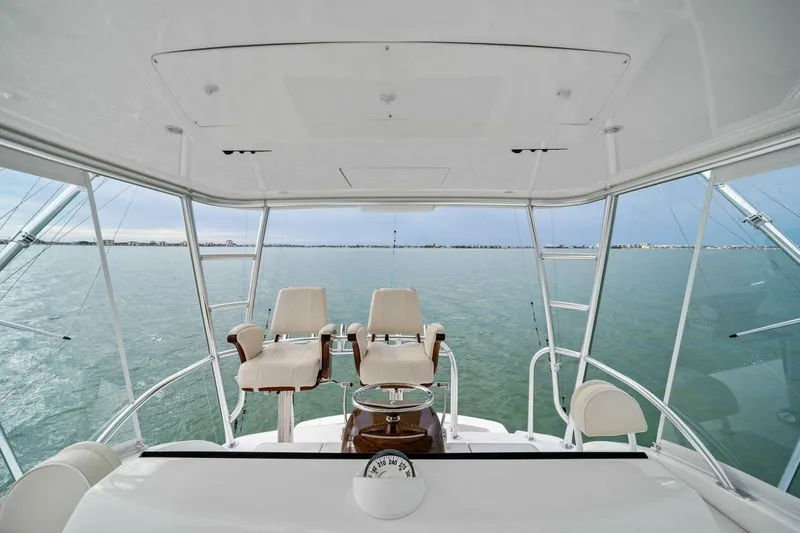 Damfino Yacht Photos Pics Flybridge view of 2021 Viking 46 Billfish yacht with ocean backdrop.