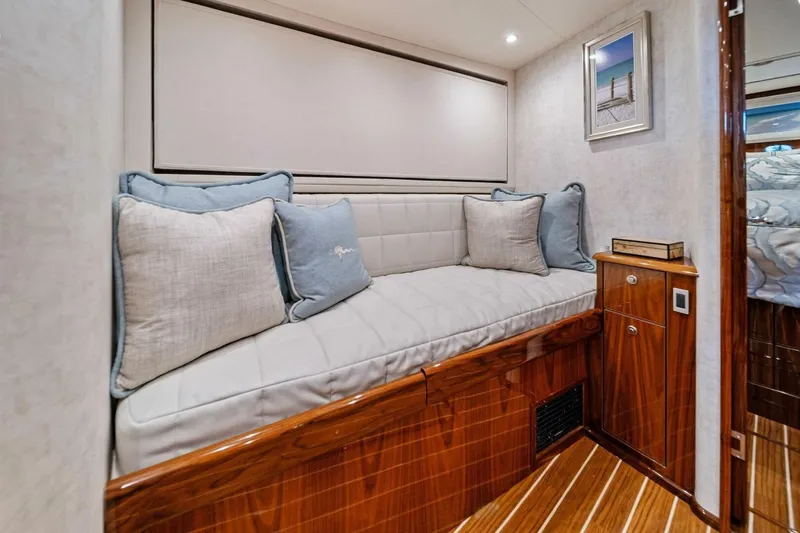 Damfino Yacht Photos Pics Luxurious interior of 2021 Viking 46 Billfish yacht with cozy seating and elegant wood finish.