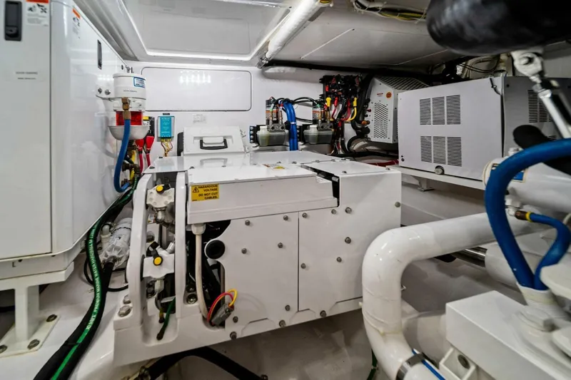 Damfino Yacht Photos Pics Engine room of 2021 Viking 46 Billfish yacht, showcasing mechanical systems and wiring.