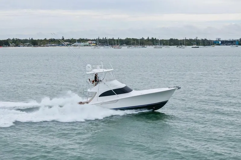 Damfino Yacht Photos Pics 2021 Viking 46 Billfish yacht cruising on open water, showcasing sleek design and performance.
