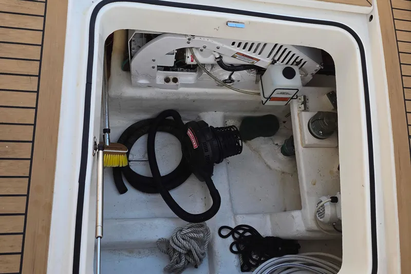 Buenos Aires Yacht Photos Pics Storage compartment of a 2003 Riviera 48 Flybridge boat with equipment and tools.