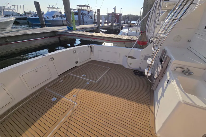 Buenos Aires Yacht Photos Pics 2003 Riviera 48 Flybridge yacht deck with teak flooring at marina.