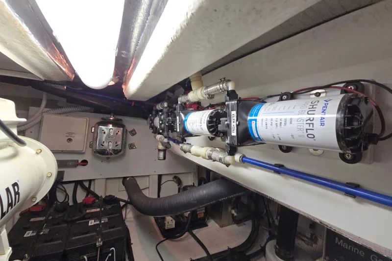 Buenos Aires Yacht Photos Pics Engine room of 2003 Riviera 48 Flybridge with Shurflo water pump system.