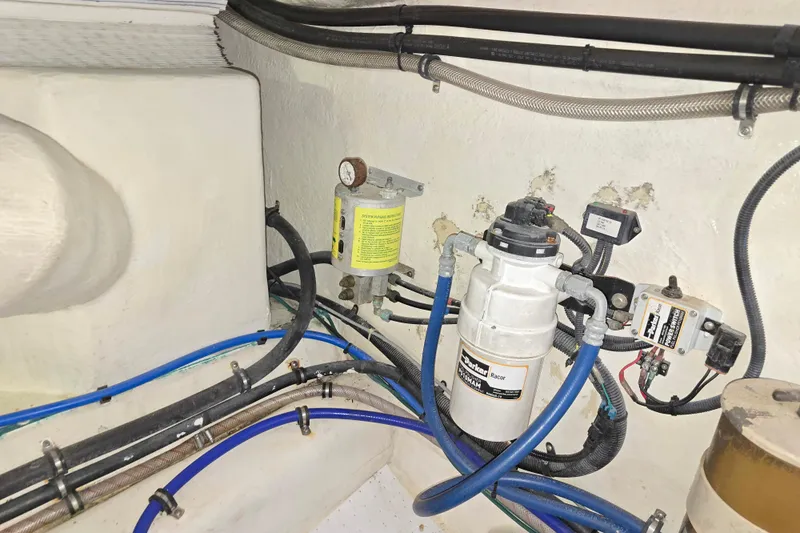 Buenos Aires Yacht Photos Pics Engine room of 2003 Riviera 48 Flybridge with fuel filtration system and wiring.