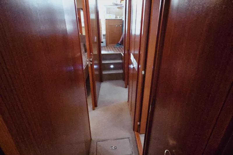 Buenos Aires Yacht Photos Pics Interior hallway of 2003 Riviera 48 Flybridge yacht with wooden finishes.