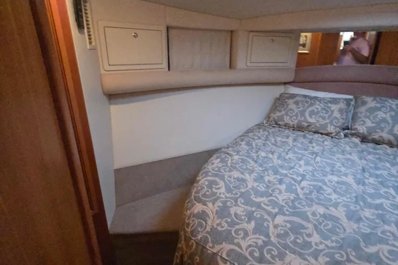 Buenos Aires Yacht Photos Pics Cozy bedroom interior of 2003 Riviera 48 Flybridge yacht with patterned bedding.