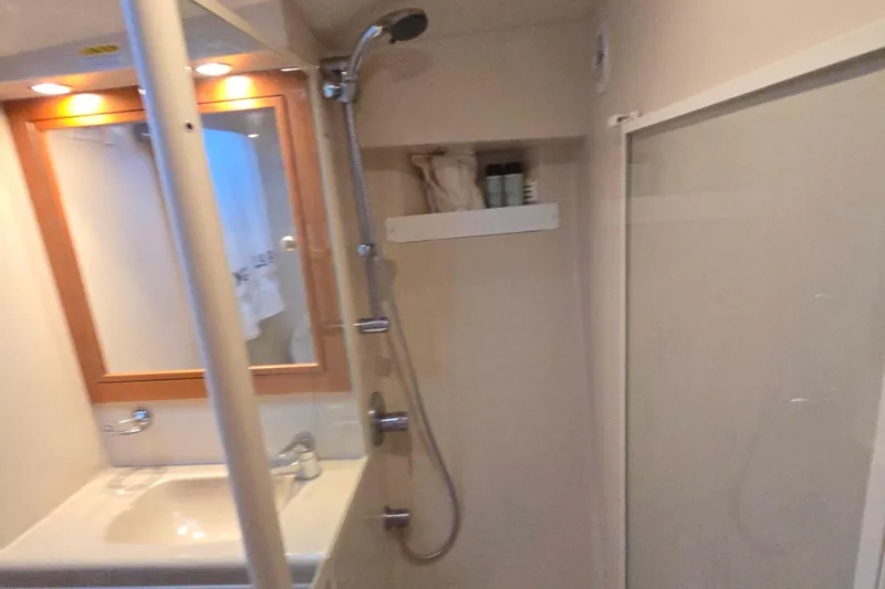 Buenos Aires Yacht Photos Pics Bathroom interior of 2003 Riviera 48 Flybridge yacht with shower and sink.