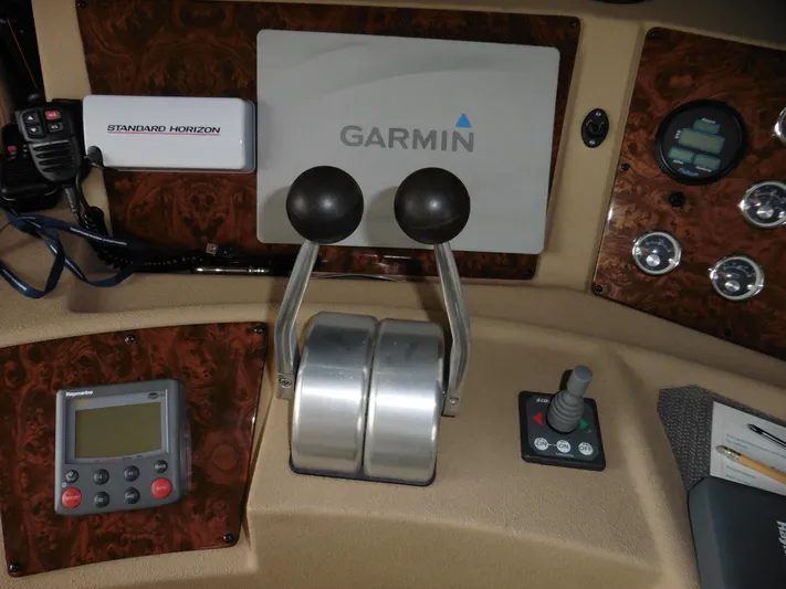 Yacht Photos Pics Control panel of 2005 Meridian PILOTHOUSE with Garmin navigation and Standard Horizon equipment.