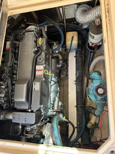  Yacht Photos Pics Engine compartment of a 2006 Albin 28 Tournament Express boat, showcasing mechanical components.