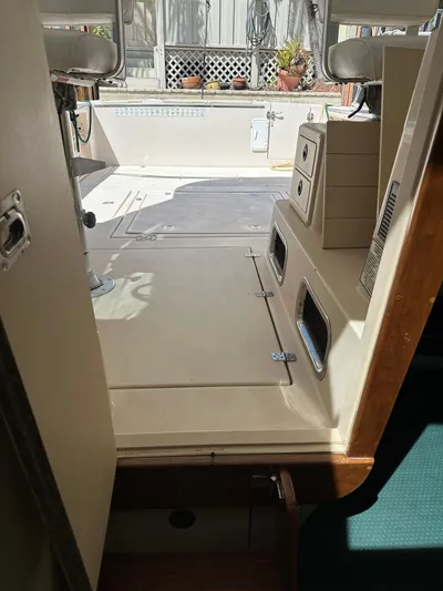  Yacht Photos Pics Interior view of 2006 Albin 28 Tournament Express boat, featuring seating and storage compartments.