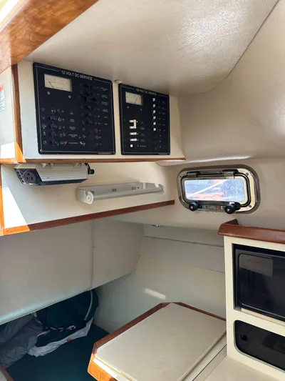  Yacht Photos Pics 2006 Albin 28 Tournament Express cabin interior with control panels and window.