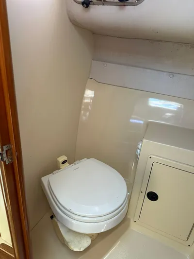  Yacht Photos Pics 2006 Albin 28 Tournament Express boat bathroom with toilet and storage cabinet.