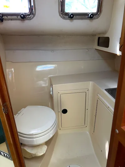  Yacht Photos Pics 2006 Albin 28 Tournament Express boat bathroom with toilet and sink.