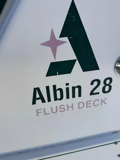  Yacht Photos Pics Albin 28 Flush Deck logo on 2006 Tournament Express boat.