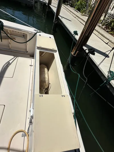  Yacht Photos Pics 2006 Albin 28 Tournament Express boat docked, open storage compartment visible.