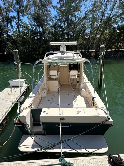  Yacht Photos Pics 2006 Albin 28 Tournament Express boat docked in a serene marina setting.