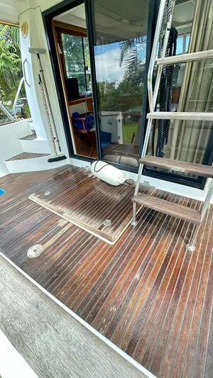  Yacht Photos Pics 2009 Beneteau Swift Trawler 34 deck with wooden flooring and ladder.