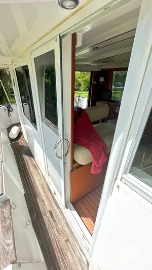  Yacht Photos Pics 2009 Beneteau Swift Trawler 34, interior view through open sliding door.